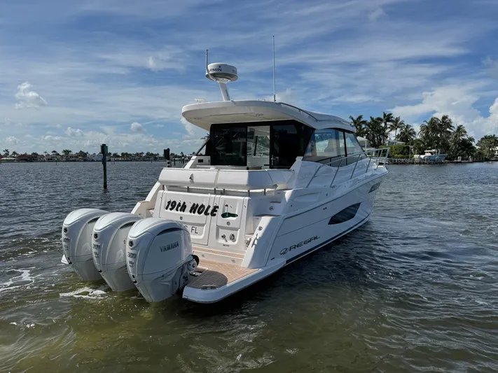 19th Hole Yacht Photos Pics 2024 Regal 38 XO yacht on water, featuring triple Yamaha outboard engines.