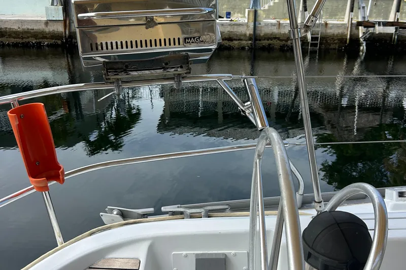 Zephyrus Yacht Photos Pics Beneteau 500 Oceanis 1991 yacht deck with grill and water view.