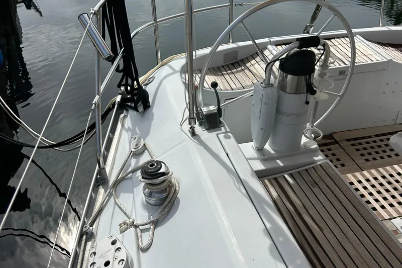 Zephyrus Yacht Photos Pics Cockpit of 1991 Beneteau 500 Oceanis sailboat with steering wheel and winch.