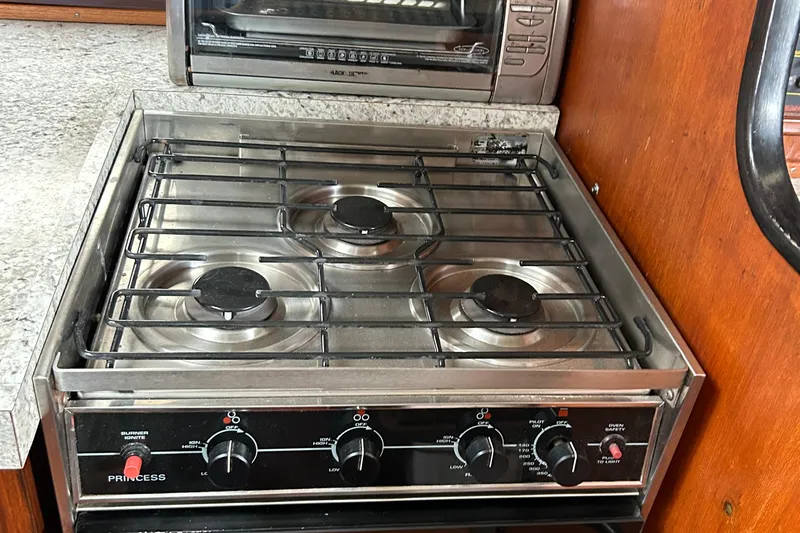 Zephyrus Yacht Photos Pics Stove and oven in 1991 Beneteau 500 Oceanis yacht kitchen.