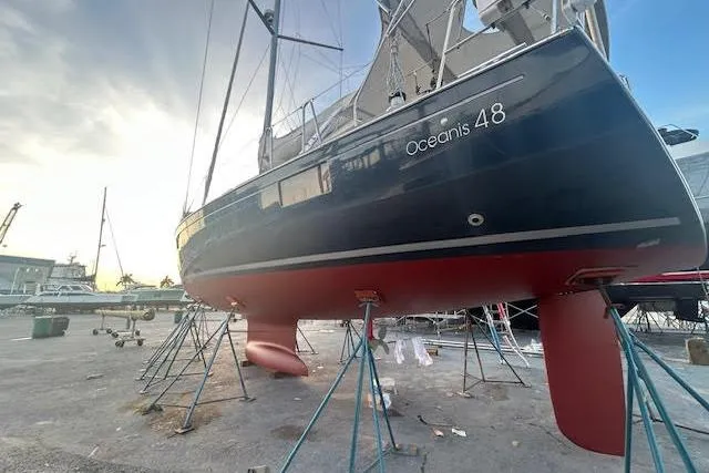 Laguna D Yacht Photos Pics 2013 Beneteau Oceanis 48 sailboat on stands, showcasing sleek design and craftsmanship.