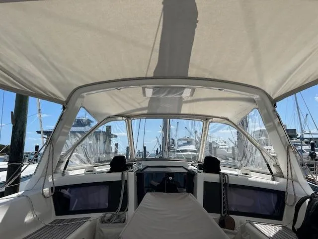 Laguna D Yacht Photos Pics Cockpit view of a 2013 Beneteau 48 sailboat docked at a marina.