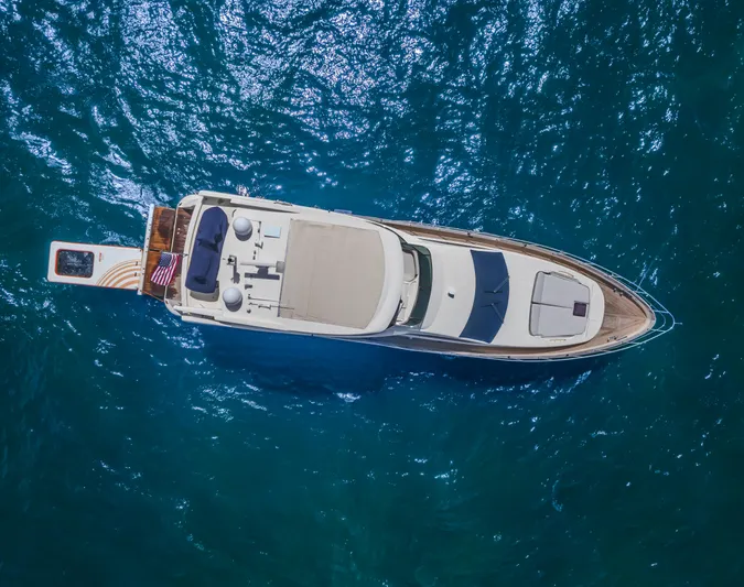 Thinks It's His Too Yacht Photos Pics Aerial view of 2008 Azimut Flybridge yacht on blue ocean water.