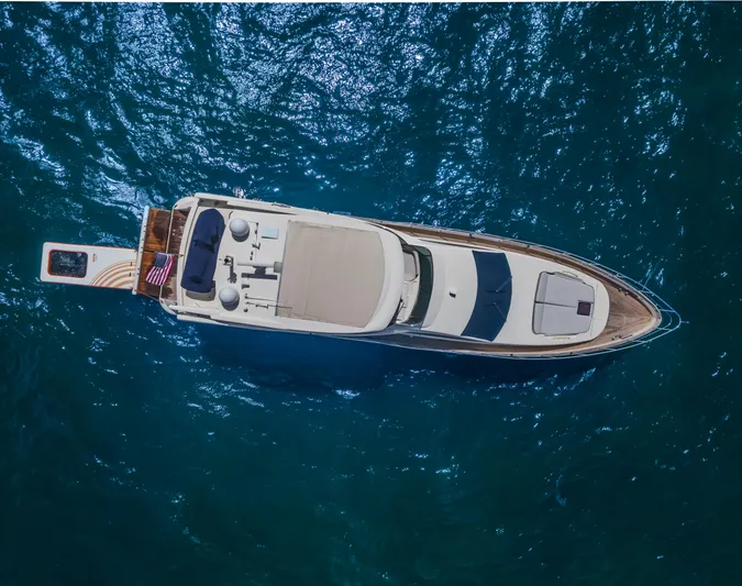 Thinks It's His Too Yacht Photos Pics Aerial view of 2008 Azimut Flybridge yacht on blue ocean water.