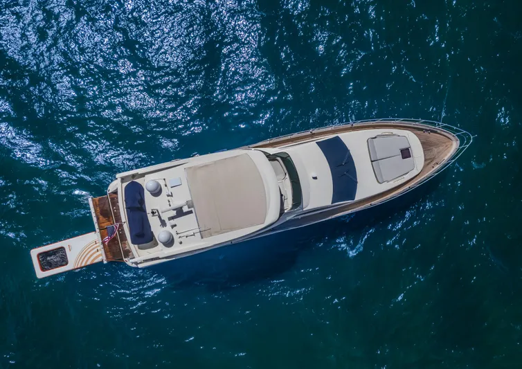 Thinks It's His Too Yacht Photos Pics Aerial view of 2008 Azimut Flybridge yacht on blue ocean water.