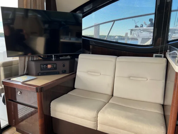  Yacht Photos Pics Interior of 2017 Sea Ray Sundancer 400 yacht with sofa and TV.