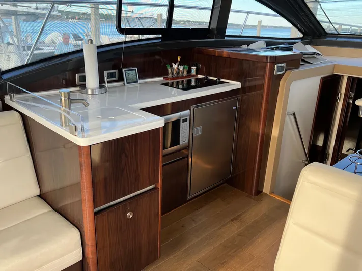  Yacht Photos Pics Interior of Sea Ray Sundancer 400 yacht, kitchen with wood finish, 2017 model.