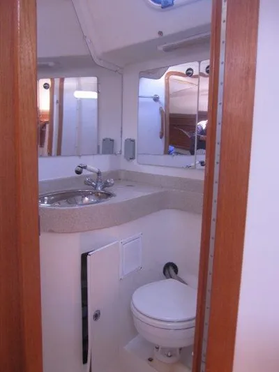  Yacht Photos Pics 2007 Catalina MkII boat bathroom with sink, mirror, and toilet.