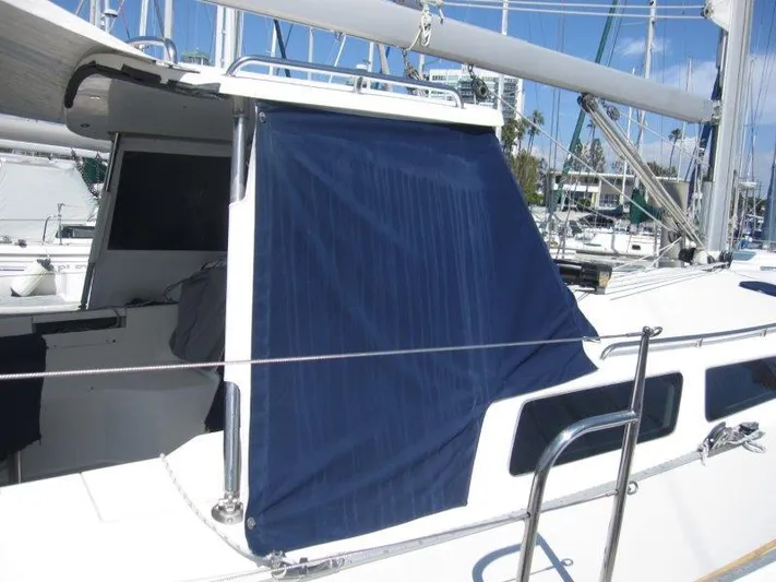  Yacht Photos Pics 2007 Catalina MkII sailboat with blue canvas cover in marina.