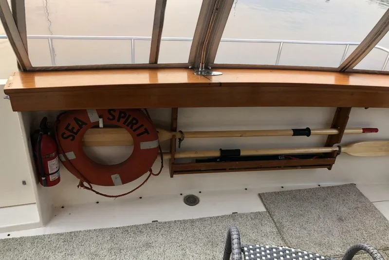  Yacht Photos Pics 1985 Bayliner 4550 Motoryacht interior with life preserver, oars, and fire extinguisher.