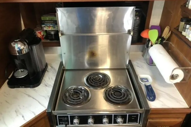  Yacht Photos Pics Galley kitchen in 1985 Bayliner 4550 Motoryacht with stove and coffee maker.