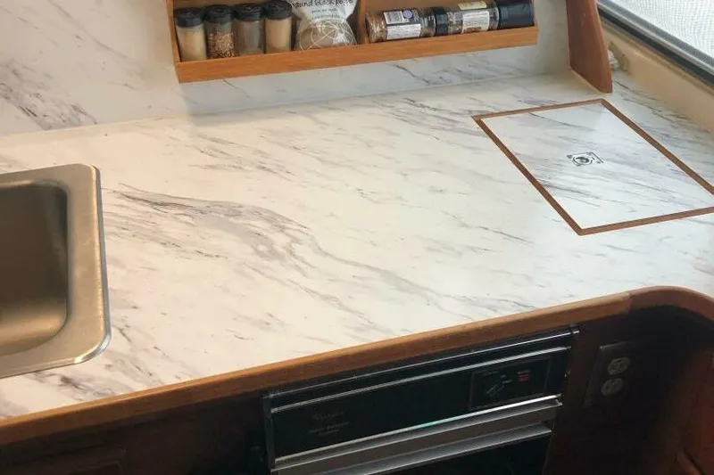  Yacht Photos Pics 1985 Bayliner 4550 Motoryacht kitchen with marble countertop and built-in stove.