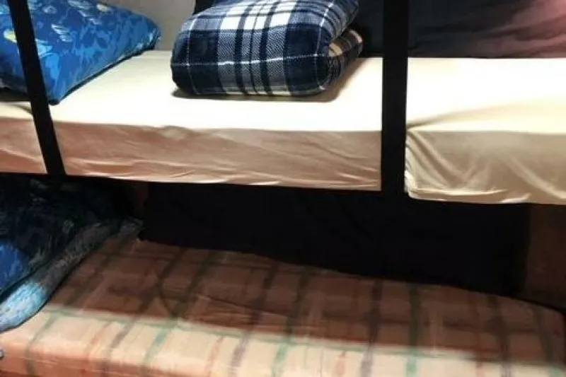  Yacht Photos Pics Bunk beds with plaid and floral bedding inside a 1985 Bayliner 4550 Motoryacht.