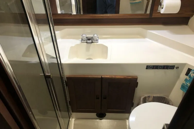  Yacht Photos Pics 1985 Bayliner 4550 Motoryacht bathroom with sink, shower, and toilet.