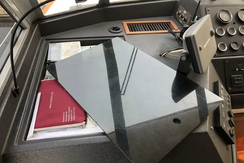  Yacht Photos Pics Dashboard of 1985 Bayliner 4550 Motoryacht with navigation equipment and maps.