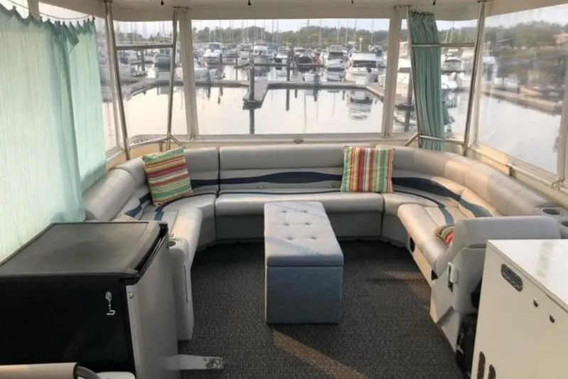  Yacht Photos Pics 1985 Bayliner 4550 Motoryacht interior with spacious seating and marina view.