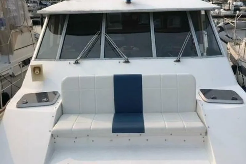  Yacht Photos Pics 1985 Bayliner 4550 Motoryacht with white and blue seating on deck.