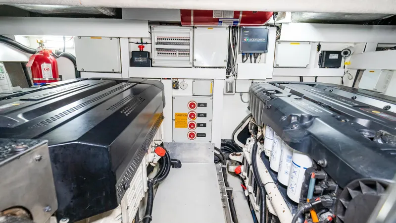 Ohana Yacht Photos Pics Engine room of 2016 Sunseeker Manhattan 55 yacht, featuring dual engines and control systems.