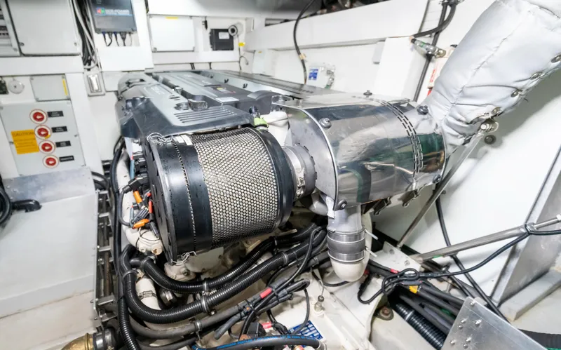 Ohana Yacht Photos Pics Engine room of 2016 Sunseeker Manhattan 55 yacht, showcasing mechanical components and wiring.