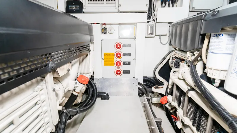 Ohana Yacht Photos Pics Engine room of 2016 Sunseeker Manhattan 55 yacht, featuring mechanical components and control panel.