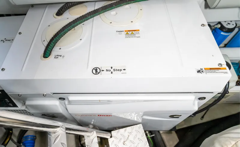 Ohana Yacht Photos Pics Engine room of 2016 Sunseeker Manhattan 55 yacht, featuring a Cummins Onan generator.