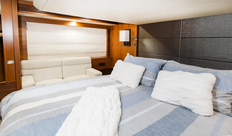Ohana Yacht Photos Pics Luxurious bedroom interior of 2016 Sunseeker Manhattan 55 yacht with cozy bedding.