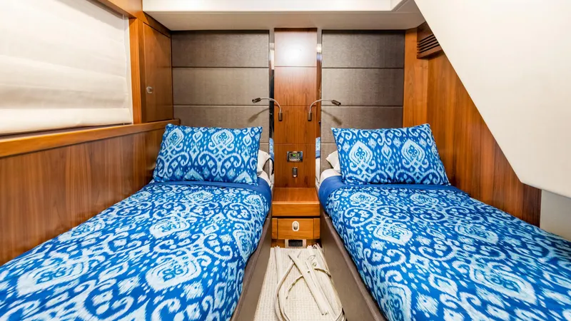 Ohana Yacht Photos Pics Twin cabin with blue bedding in 2016 Sunseeker Manhattan 55 yacht.