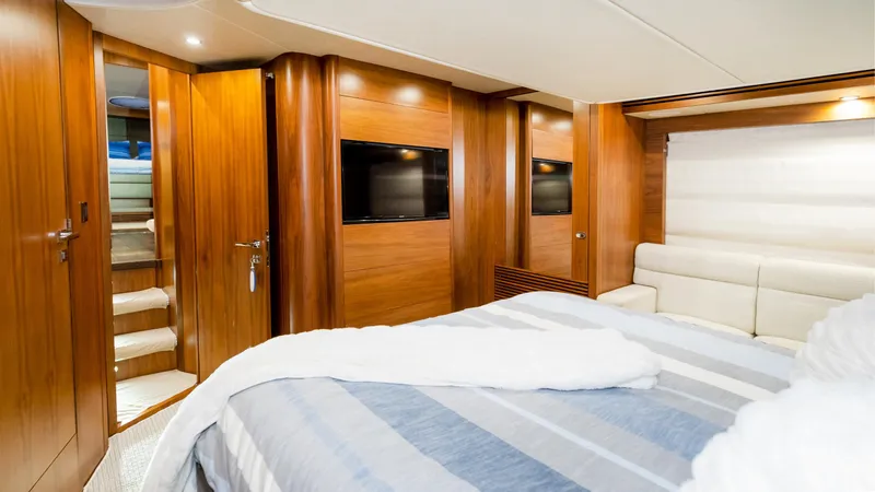 Ohana Yacht Photos Pics Luxurious cabin interior of 2016 Sunseeker Manhattan 55 yacht with wood paneling and modern amenities.