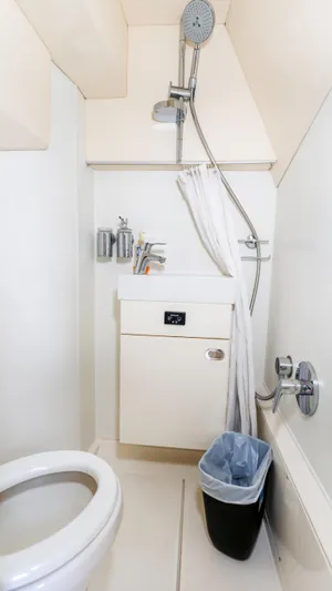 Ohana Yacht Photos Pics Compact bathroom in 2016 Sunseeker Manhattan 55 yacht with shower and toilet.