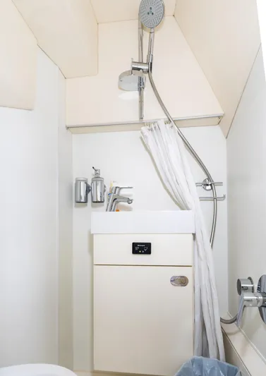Ohana Yacht Photos Pics Compact bathroom in a 2016 Sunseeker Manhattan 55 yacht with shower and sink.