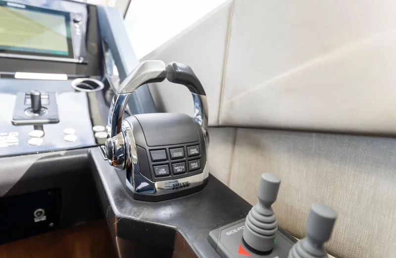 Ohana Yacht Photos Pics Control panel of a 2016 Sunseeker Manhattan 55 yacht, featuring throttle and joystick controls.