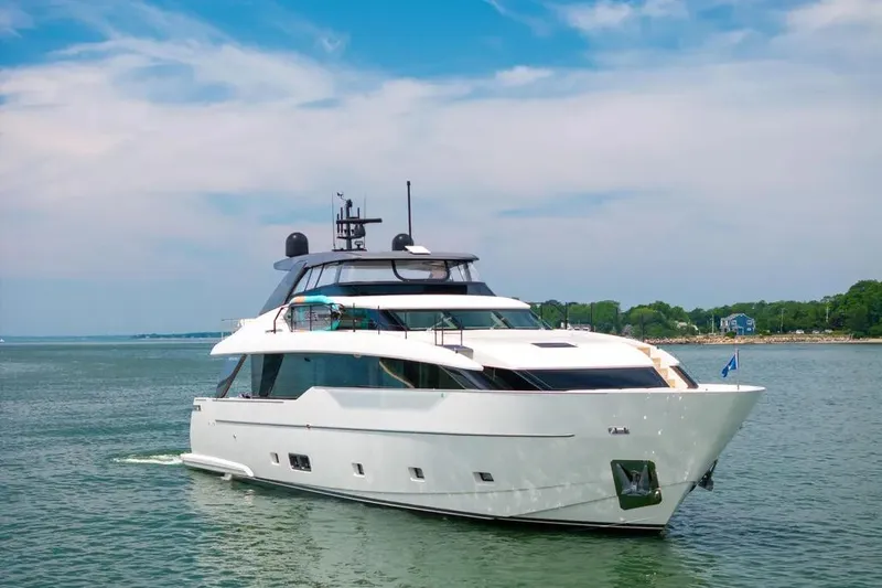 Sl90a Yacht Photos Pics 2024 Sanlorenzo SL90A yacht cruising on serene waters under a clear blue sky.