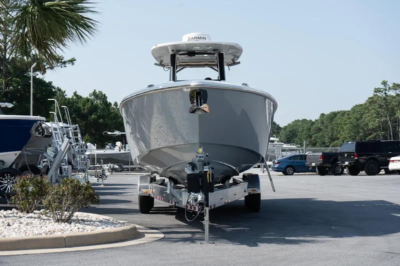  Yacht Photos Pics 2025 Solace 32 CS boat on trailer in parking lot.