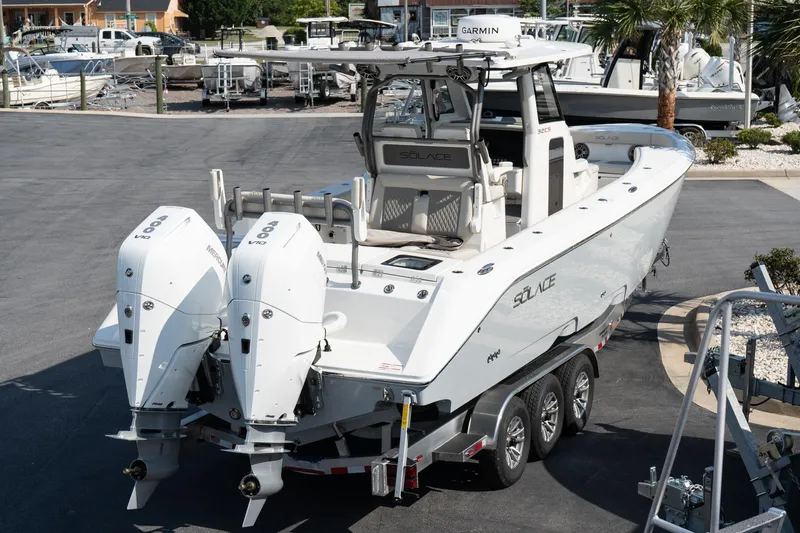  Yacht Photos Pics 2025 Solace 32 CS boat with dual Mercury engines on a trailer.