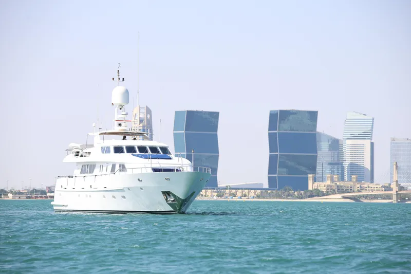  Yacht Photos Pics Luxurious 1999 Codecasa 105 Custom yacht sailing near modern city skyline.