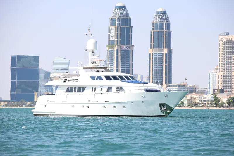  Yacht Photos Pics Luxurious 1999 Codecasa 105 Custom yacht cruising near modern city skyline.