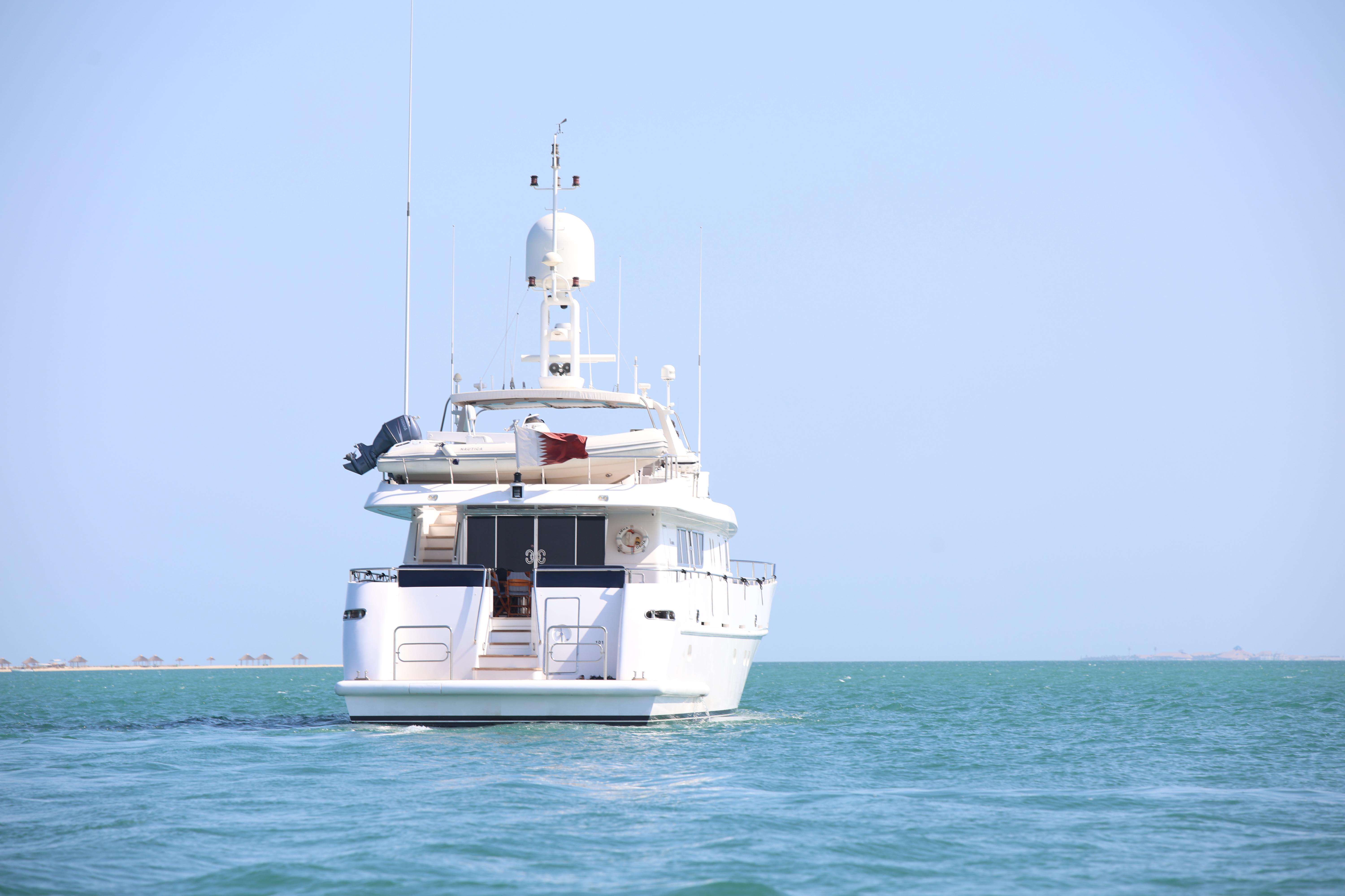 Luxury yacht Codecasa 105 Custom, 1999 model, cruising on calm blue waters.