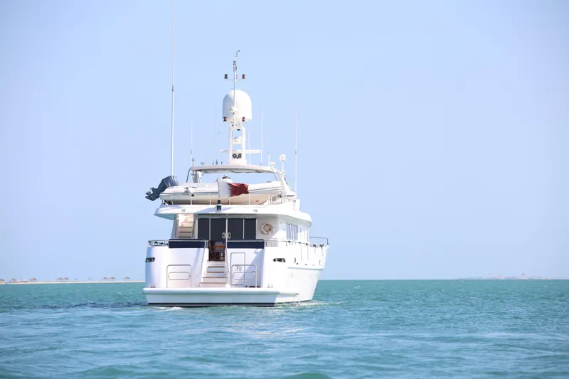  Yacht Photos Pics Luxury yacht Codecasa 105 Custom, 1999 model, cruising on calm blue waters.