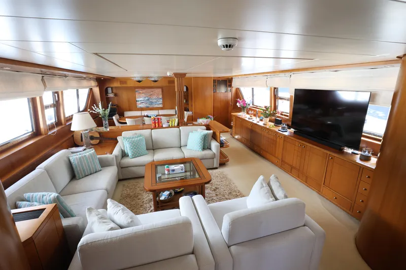  Yacht Photos Pics Luxurious interior of 1999 Codecasa 105 Custom yacht with elegant seating and large TV.