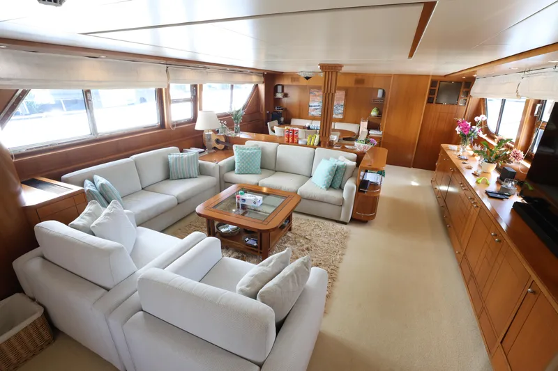  Yacht Photos Pics Luxurious interior of 1999 Codecasa 105 Custom yacht with elegant seating and wooden accents.
