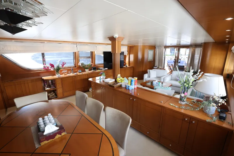  Yacht Photos Pics Luxurious interior of 1999 Codecasa 105 Custom yacht with elegant wood finishes and modern amenities.