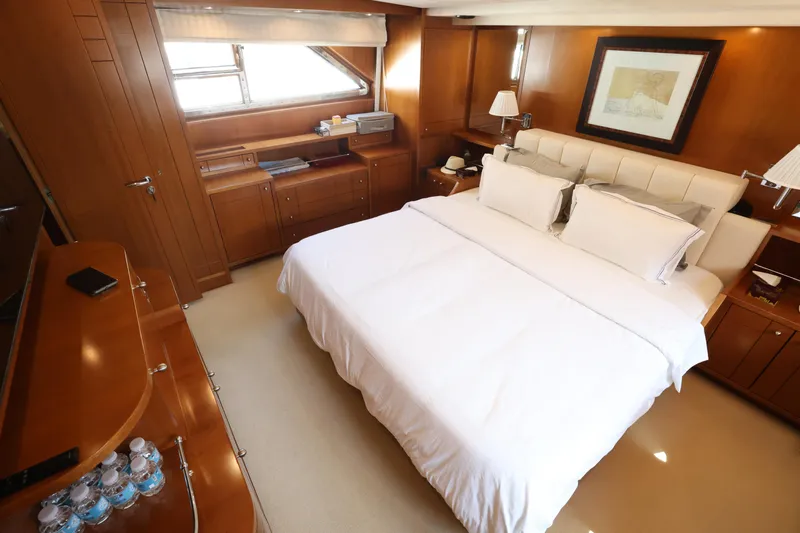  Yacht Photos Pics Luxurious bedroom interior on 1999 Codecasa 105 Custom yacht with elegant wood finishes.