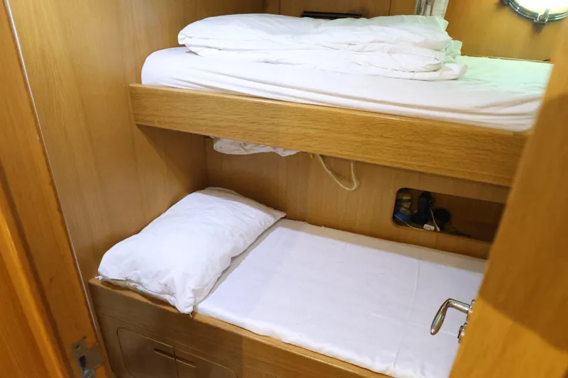  Yacht Photos Pics Bunk beds in 1999 Codecasa 105 Custom yacht cabin with wooden interior.