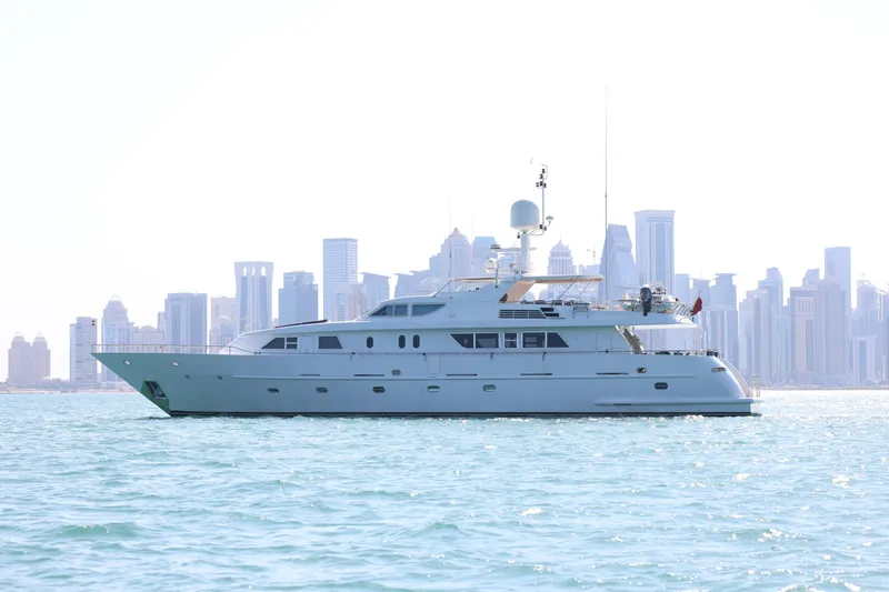  Yacht Photos Pics Luxury yacht Codecasa 105 Custom 1999 cruising with city skyline backdrop.
