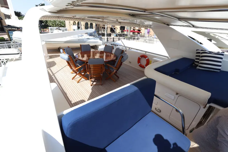  Yacht Photos Pics Luxurious 1999 Codecasa 105 Custom yacht deck with seating and dining area.
