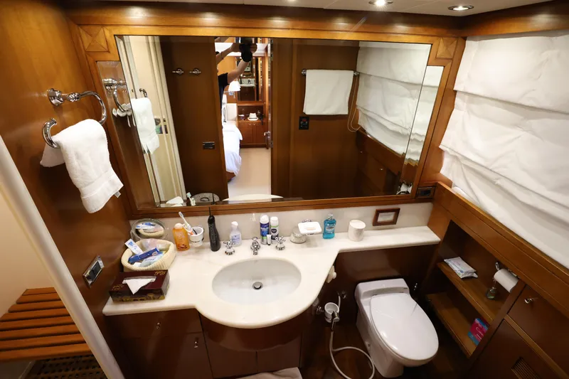  Yacht Photos Pics Luxurious bathroom in 1999 Codecasa 105 Custom yacht with elegant wood finishes.