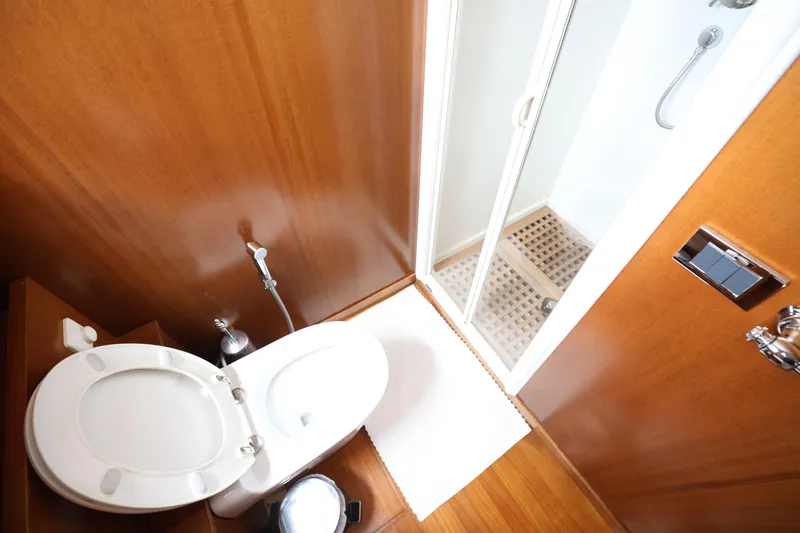  Yacht Photos Pics Bathroom interior of 1999 Codecasa 105 Custom yacht with shower and toilet.