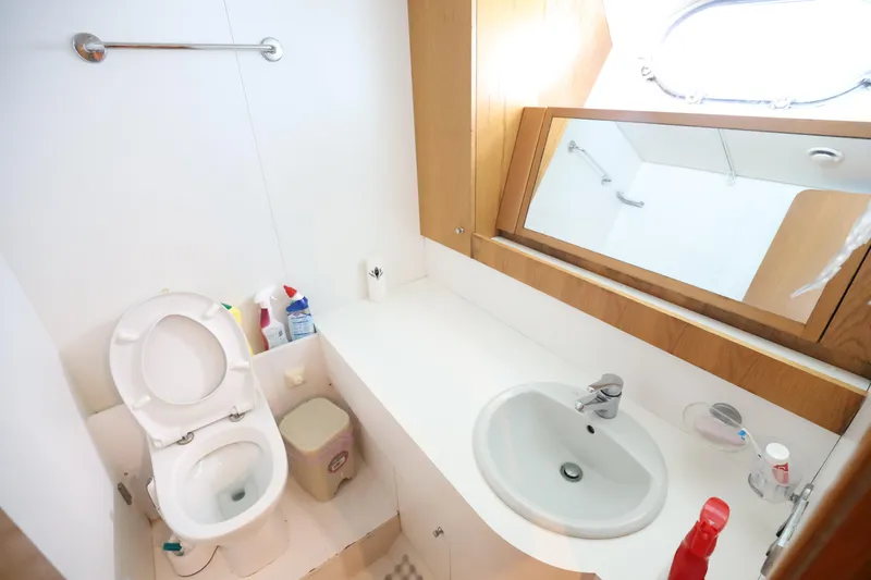  Yacht Photos Pics Bathroom interior of 1999 Codecasa 105 Custom yacht with sink, toilet, and mirror.