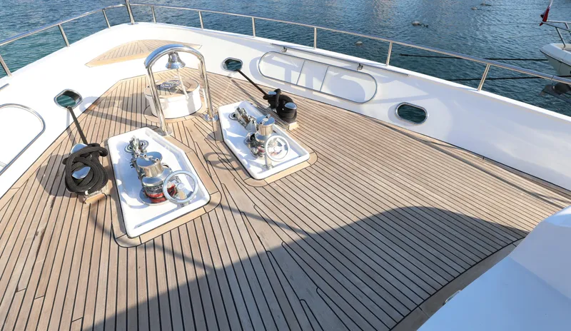  Yacht Photos Pics Deck of 1999 Codecasa 105 Custom yacht with wooden flooring and nautical equipment.