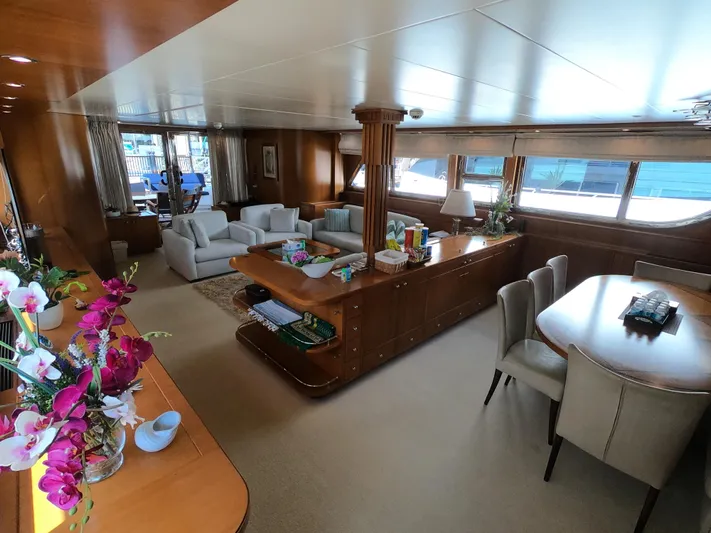  Yacht Photos Pics Luxurious interior of 1999 Codecasa 105 Custom yacht with elegant seating and dining area.